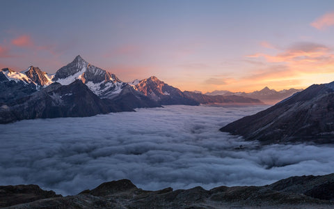 Person standing in open landscape at sunrise, symbolising freedom from smoking and alcohol habits