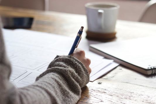 Student sitting calmly at a desk, representing research on hypnotherapy and exam anxiety