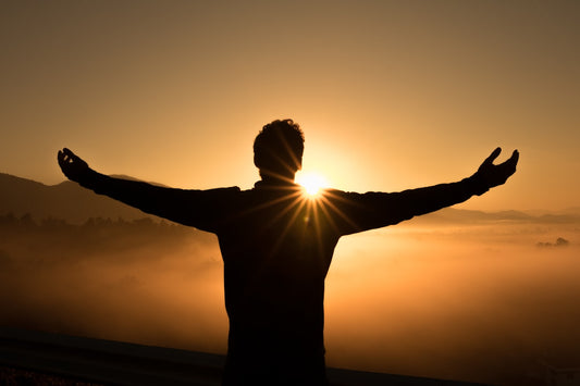 Woman sitting calmly in a mindful pose, representing the inner peace hypnotherapy can help restore