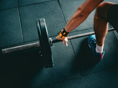 An athlete sitting in focused stillness before competition, representing the mental preparation benefits of hypnotherapy for sports performance