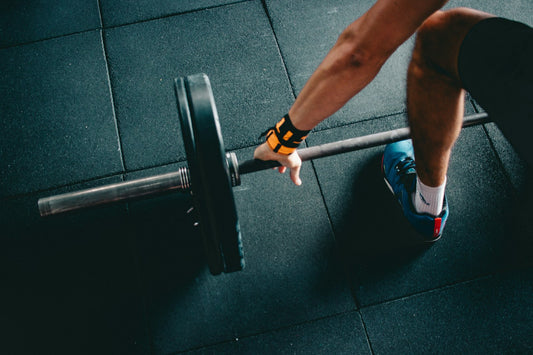 An athlete sitting in focused stillness before competition, representing the mental preparation benefits of hypnotherapy for sports performance