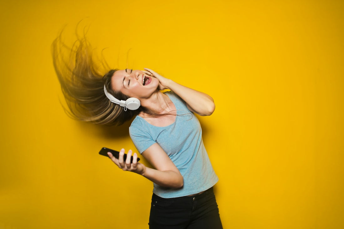 Person breathing fresh outdoor air representing freedom and relief after quitting smoking with hypnotherapy