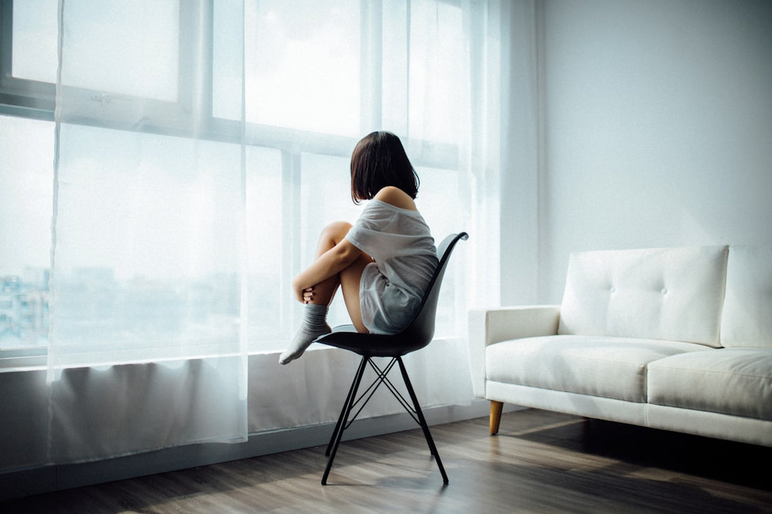 Person in a calm, relaxed state during a therapy session — representing hypnotherapy for depression