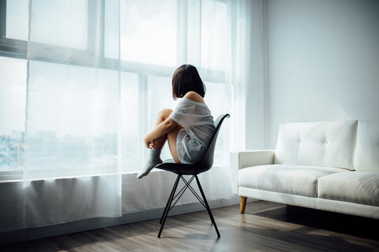 Person in a calm, relaxed state during a therapy session — representing hypnotherapy for depression