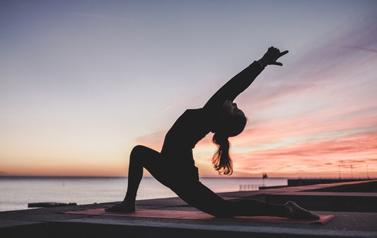 Person sitting in calm meditation, representing mind-body pain relief through hypnotherapy